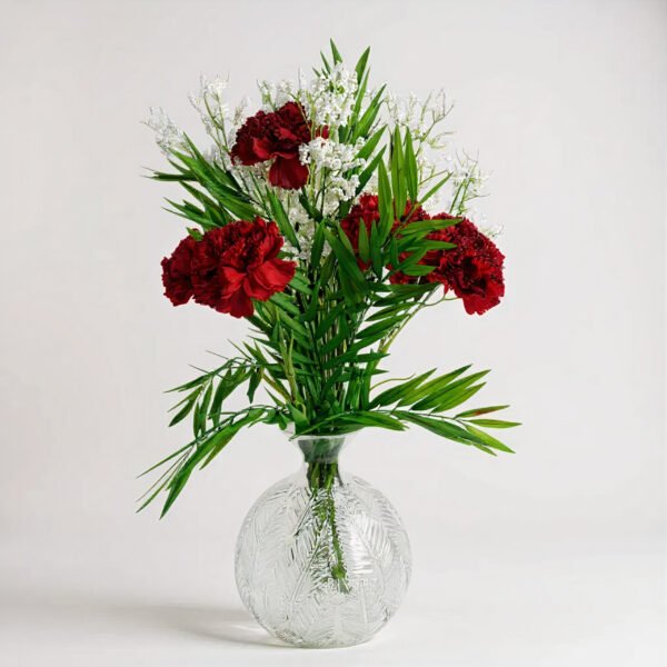 Red Carnation Arrangement in Fern Print Glass Vase